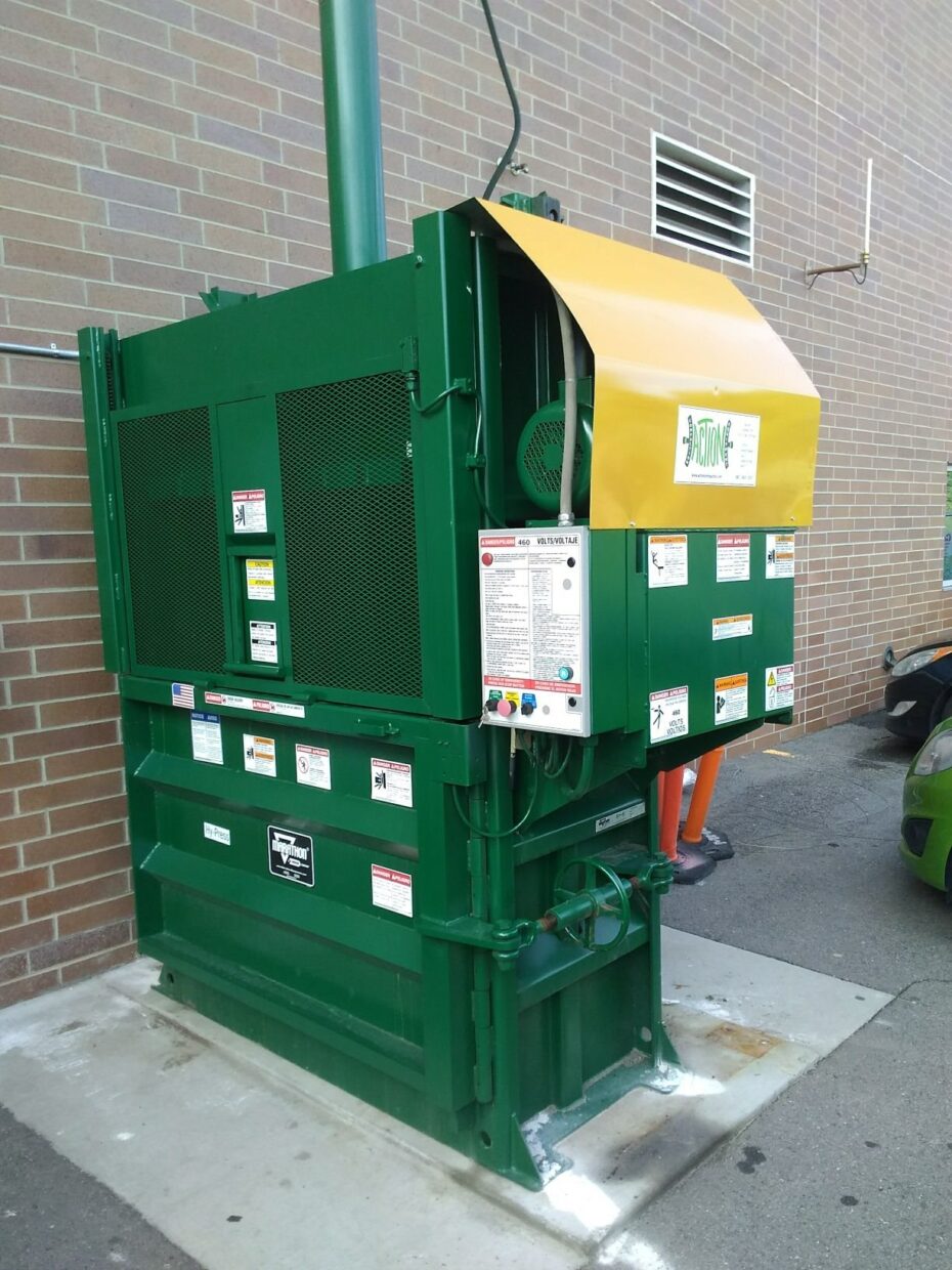 Vertical Baler outside an industrial building