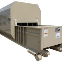 A large industrial compactor with wheels and several warning labels, designed for waste management and storage.